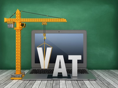 Crane lowering the letter V for VAT