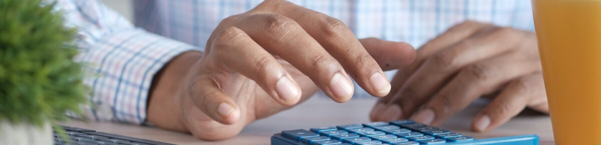 A man using a calculator