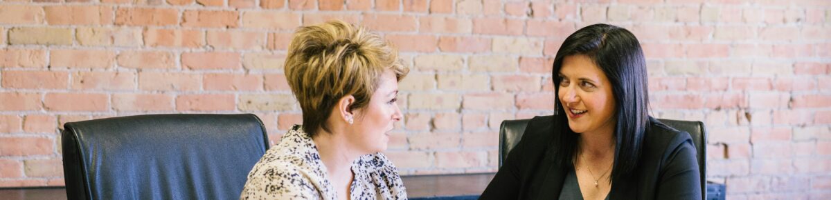 Two women having a discussion in an office