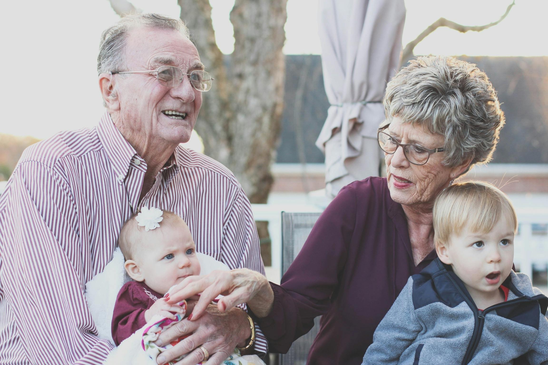 Grandparents holding their grandchildren